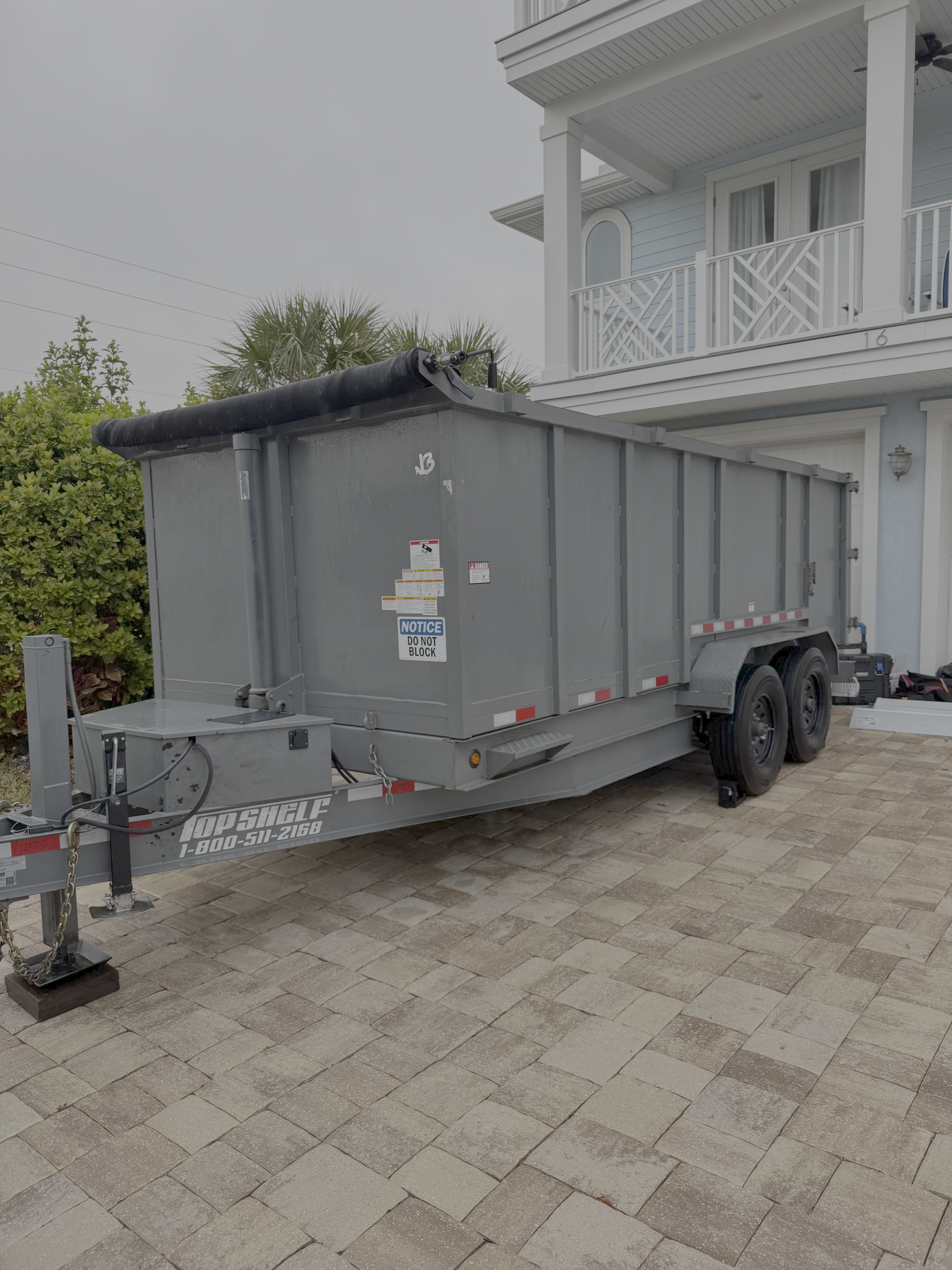 Dump trailer placed for debris removal on a job site in Jacksonville, Florida